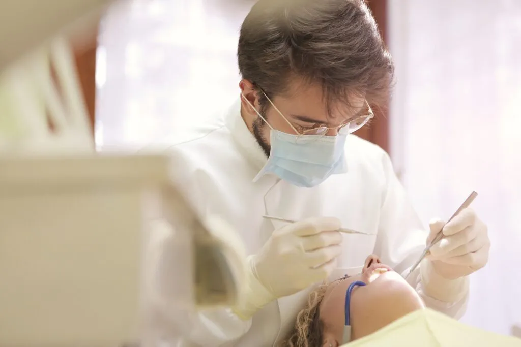 Dentist working on childs teeth